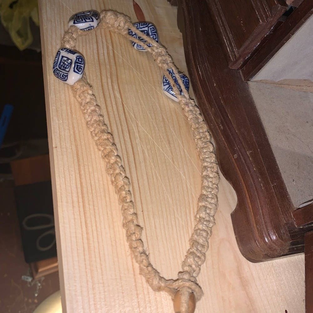 Surfer necklace with big white graffitied stone